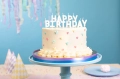 ŚWIECZKI URODZINOWE HAPPY BIRTHDAY BIAŁE 25cm 13szt